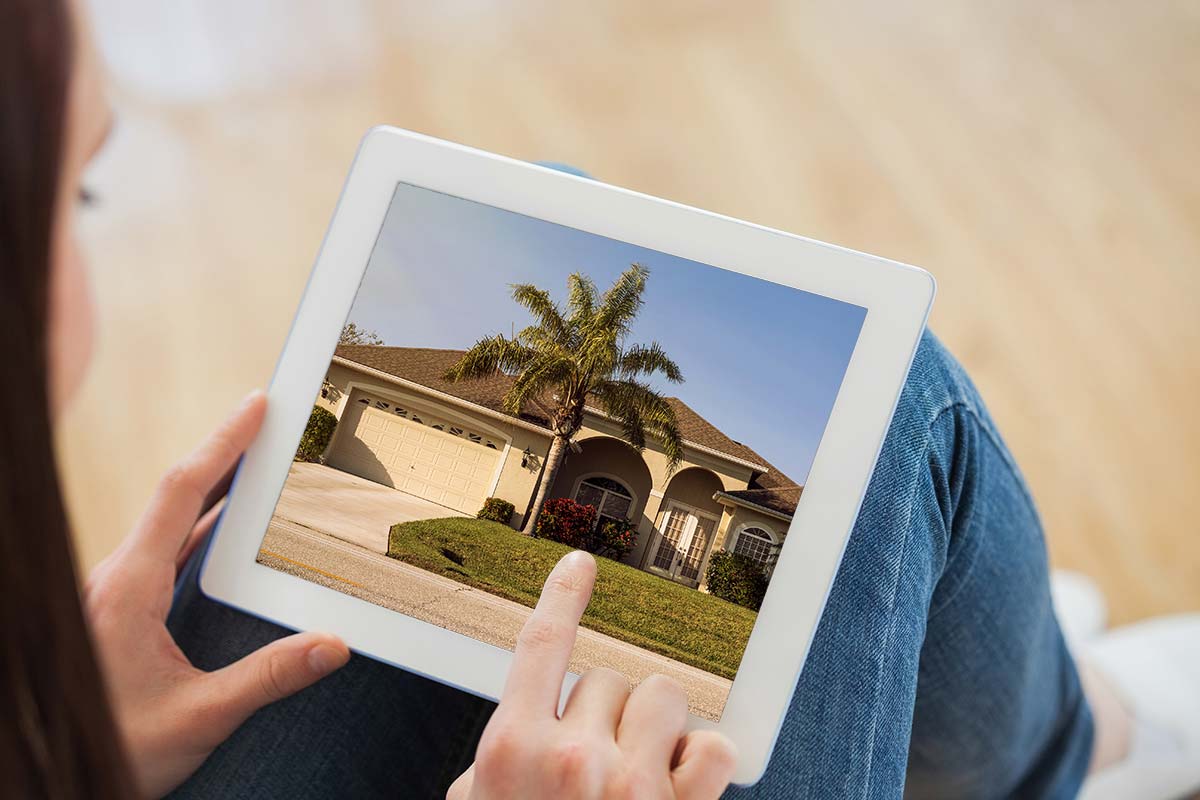 Person using a tablet to see their online, digital home inspection report